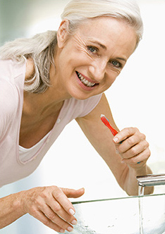 Older woman brushing